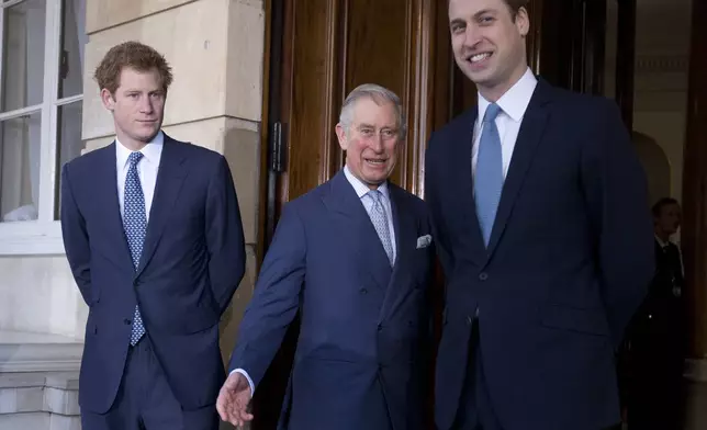 FILE - Britain's Prince Charles, center, with his sons Prince William, right, and Prince Harry stops for the media outside Lancaster House as they arrive to attend the Illegal Wildlife Trade Conference in London, on Feb. 13, 2014. (AP Photo/Alastair Grant, Pool, File)