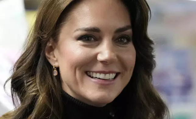 FILE - Britain's Kate, Princess of Wales smiles as she speaks to a woman during her visit to Sebby's Corner in north London on Nov. 24, 2023. (AP Photo/Frank Augstein, Pool, File)