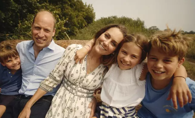 This photo provided by Kensington Palace on Monday, Sept. 9, 2024, shows Kate, Princess of Wales and Prince William with their children Prince George, right, Princess Charlotte and Prince Louis, left. (Will Warr/Kensington Palace via AP)