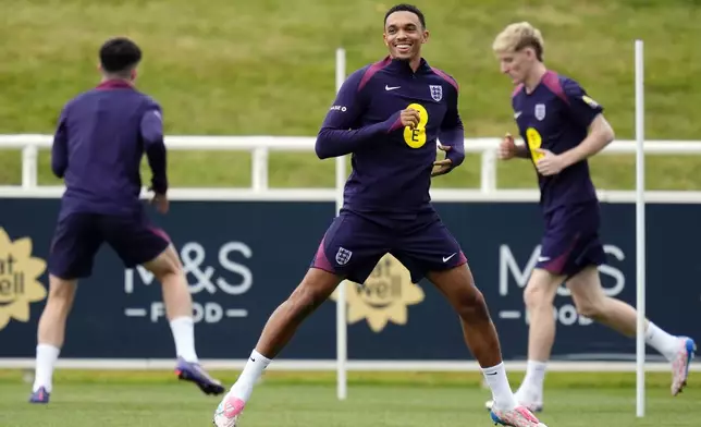 England's Trent Alexander-Arnold, front, attends a training session of England's national soccer team in Burton upon Trent, England, Wednesday, Sept. 4, 2024. (Nick Potts/PA via AP)