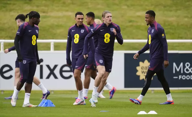 England's Conor Gallagher, front center, runs during a training session of England's national soccer team in Burton upon Trent, England, Wednesday, Sept. 4, 2024. (Nick Potts/PA via AP)