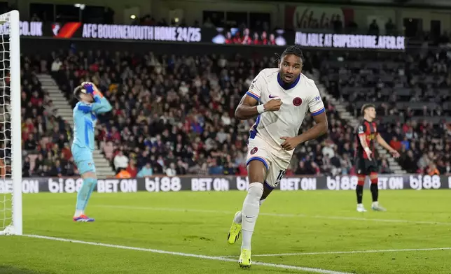 Chelsea's Christopher Nkunku celebrates after scoring the opening goal of the game against Bournemouth during a Premier League match at the Vitality Stadium, Saturday, Sept. 14, 2024, in Bournemouth, England. (Andrew Matthews/PA via AP)