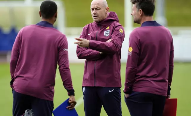 England's interim manager Lee Carsley, center, gestures during a training session of England's national soccer team in Burton upon Trent, England. Wednesday, Sept. 4, 2024. (Nick Potts/PA via AP)