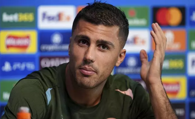 Manchester City's Rodri attends a press conference at the City Football Academy in Manchester, England, Tuesday Sept. 17, 2024. (Martin Rickett/PA via AP)