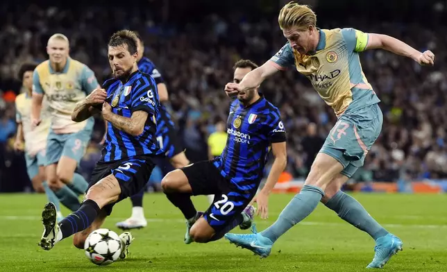 Manchester City's Kevin De Bruyne, right, shoots during the Champions League opening phase soccer match between Manchester City and Inter Milan in Manchester, England, Wednesday, Sept. 18, 2024. (Nick Potts/PA via AP)