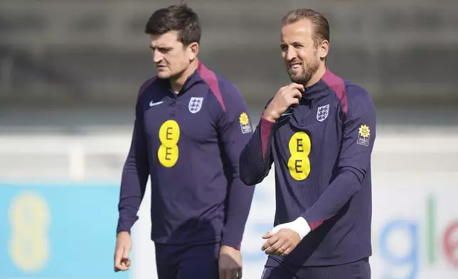 England's Harry Kane and Harry Maguire during a training session at St George's Park, Burton-on-Trent, Britain, Friday Sept. 6, 2024. (Joe Giddens/PA via AP)