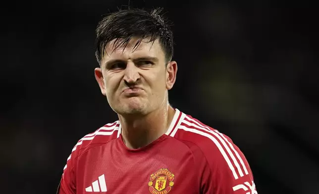 Manchester United's Harry Maguire reacts during the Europa League opening phase soccer match between Manchester United and Twente at the Old Trafford stadium in Manchester, England, Wednesday, Sept. 25, 2024. (AP Photo/Dave Thompson)