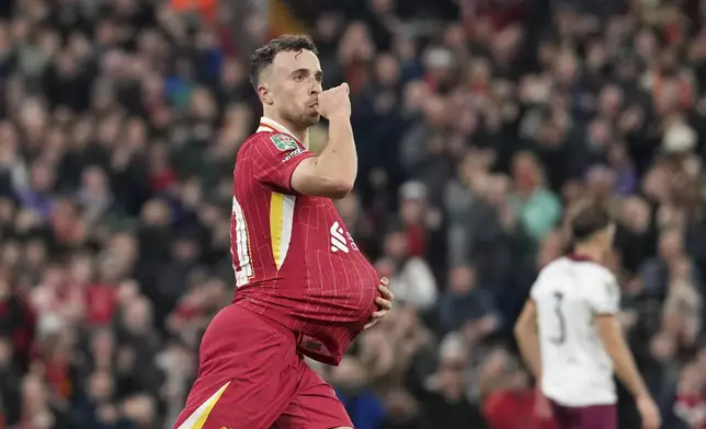 Liverpool's Diogo Jota celebrates after scoring his side's first goal during the English League Cup soccer match between Liverpool and West Ham United at Anfield Stadium, Liverpool, England, Wednesday, Sept. 25, 2024. (AP Photo/Jon Super)