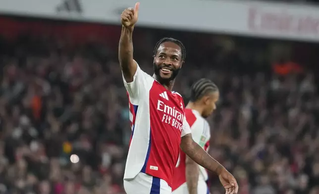 Arsenal's Raheem Sterling celebrates after scored his side's the fourth goal during the English League Cup third round soccer match between Arsenal and Bolton Wanderers at the Emirates stadium in London, Wednesday, Sept. 25, 2024. (AP Photo/Kirsty Wigglesworth)