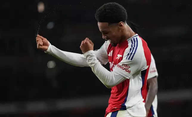 Arsenal's Ethan Nwaneri celebrates after scored his side's the second goal during the English League Cup third round soccer match between Arsenal and Bolton Wanderers at the Emirates stadium in London, Wednesday, Sept. 25, 2024. (AP Photo/Kirsty Wigglesworth)