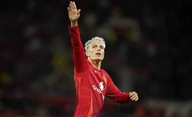 Manchester United's Alejandro Garnacho celebrates after scoring his side's fourth goal during the English League Cup soccer match between Manchester United and Barnsley at Old Trafford, Manchester, England, Tuesday, Sept. 17, 2024. (AP Photo/Dave Thompson)