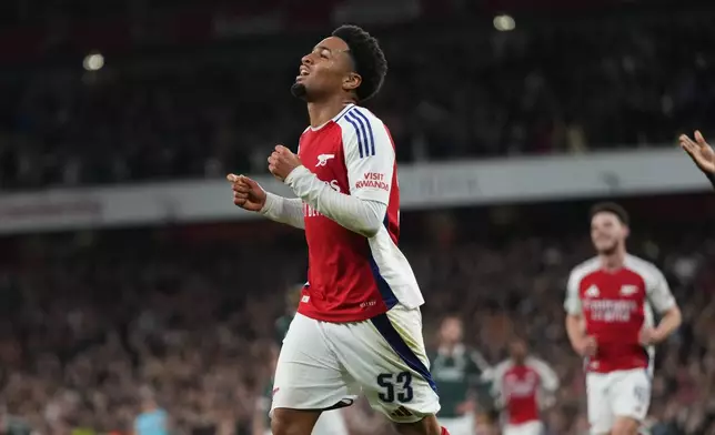 Arsenal's Ethan Nwaneri celebrates after scored his side's the second goal during the English League Cup third round soccer match between Arsenal and Bolton Wanderers at the Emirates stadium in London, Wednesday, Sept. 25, 2024. (AP Photo/Kirsty Wigglesworth)