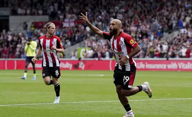 Brentford's Bryan Mbeumo celebrates scoring during the English Premier League soccer match between Brentford and Southampton at the Gtech Community Stadium, London, Saturday Aug. 31, 2024. (Aaron Chown/PA via AP)