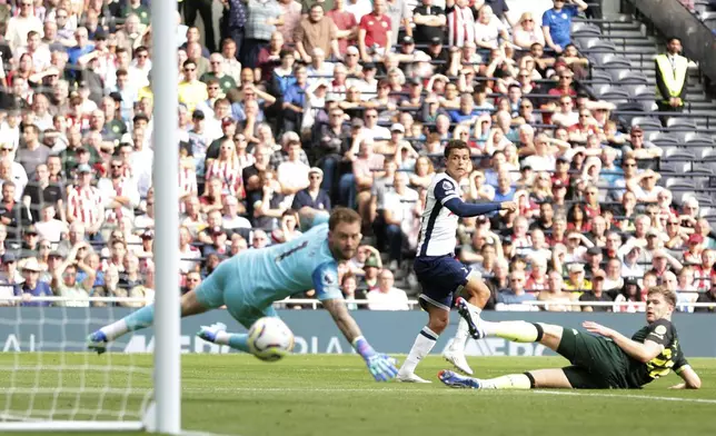 Tottenham Hotspur's Brennan Johnson, center scores his side's second goal of the game, during the English Premier League soccer match between Tottenham Hotspur and Brentford, at the Tottenham Hotspur Stadium, in London, Saturday, Sept. 21, 2024. (Steven Paston/PA via AP)