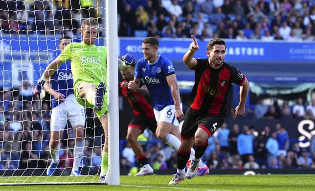 Bournemouth's Lewis Cook, right, celebrates scoring during the English Premier League soccer match between Everton and Bournemouth at Goodison Park, Liverpool, England, Saturday Aug. 31, 2024. (Peter Byrne/PA via AP)