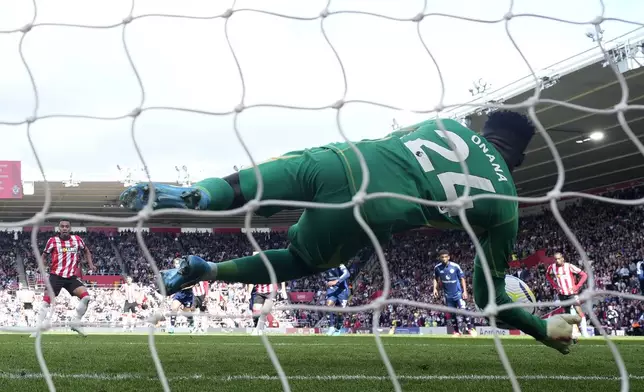 Manchester United's goalkeeper Andre Onana save a penalty from Southampton's Cameron Archer during the English Premier League soccer match between Southampton and Manchester United at St. Mary's stadium in Southampton, England, Saturday, Sept. 14, 2024. (AP Photo/Alastair Grant)