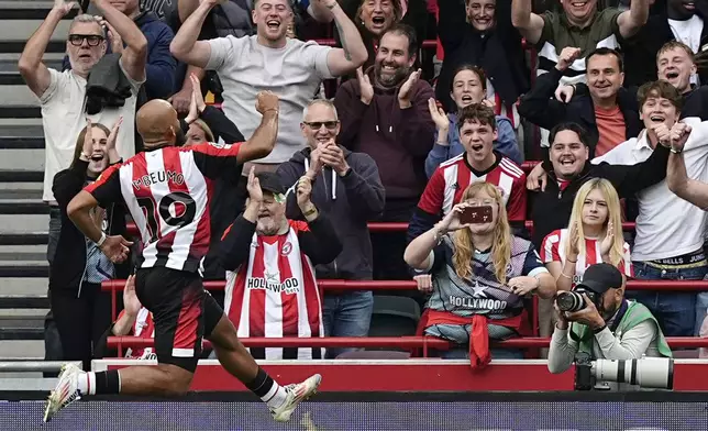 Brentford's Bryan Mbeumo celebrates scoring during the English Premier League soccer match between Brentford and Southampton at the Gtech Community Stadium, London, Saturday Aug. 31, 2024. (Aaron Chown/PA via AP)