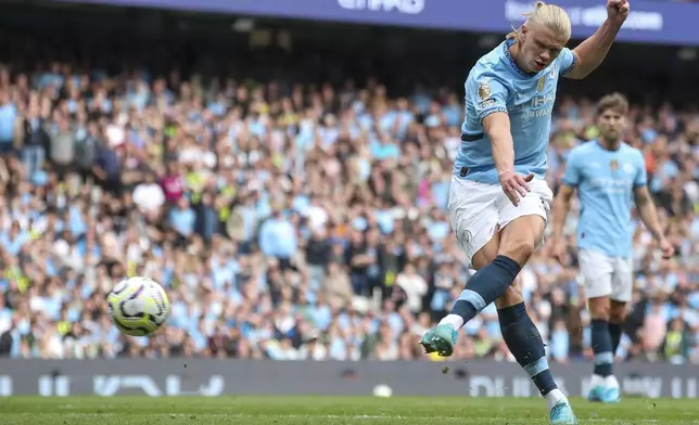 Manchester City's Erling Haaland kicks the ball during the English Premier League soccer match between Manchester City and Brentford at the Etihad Stadium in Manchester, England, Saturday, Sept. 14, 2024. (AP Photo/Scott Heppel)