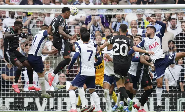 Arsenal's Gabriel scores the opening goal during the English Premier League soccer match between Tottenham Hotspur and Arsenal in London, Sunday, Sept. 15, 2024. (AP Photo/Kin Cheung)