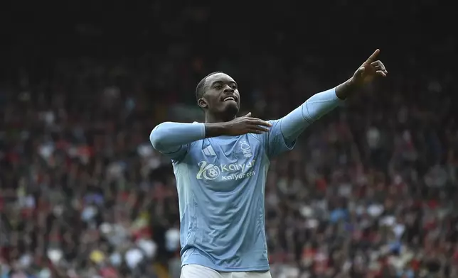 Nottingham Forest's Callum Hudson-Odoi celebrates scoring his side's opening goal during the English Premier League soccer match between Liverpool and Nottingham Forest at Anfield Stadium in Liverpool, England, Saturday, Sept. 14, 2024. (AP Photo/Rui Vieira)