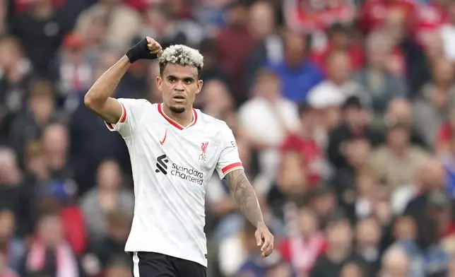 Liverpool's Luis Diaz celebrates after scoring during the English Premier League soccer match between Manchester United and Liverpool at Old Trafford, Sunday, Sept. 1, 2024, in Manchester, England. (AP Photo/Dave Thompson)