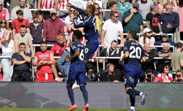 Manchester United's Marcus Rashford, center, celebrates after scoring his side's second goal during the English Premier League soccer match between Southampton and Manchester United at St. Mary's stadium in Southampton, England, Saturday, Sept. 14, 2024. (AP Photo/Alastair Grant)