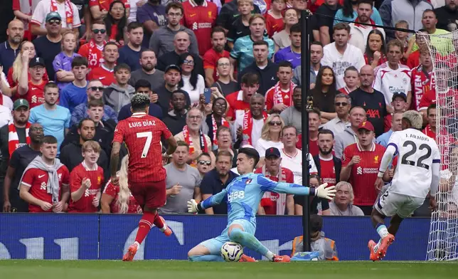 Liverpool's Luis Diaz scores his side's second goal of the game, during the English Premier League soccer match between Liverpool and Bournemouth, at Anfield, in Liverpool, England, Saturday, Sept. 21, 2024. (Peter Byrne/PA via AP)