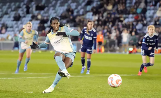 Manchester City's Aoba Fujino scores their side's third goal of the game from the penalty spot during the UEFA Women's Champions League, Second Round Qualifying, Second Leg match between Manchester City and Paris FC at the Manchester City Academy Stadium in Manchester, England, Thursday Sept. 26, 2024. (Danny Lawson/PA via AP)