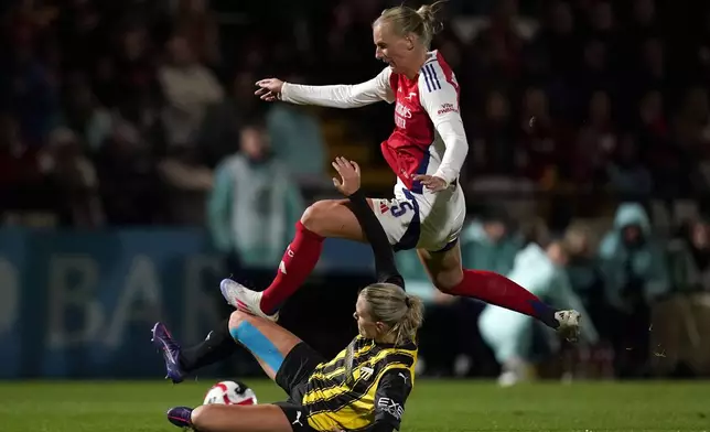 BK Hacken's Josefine Rybrink, bottom, challenges Arsenal's Stina Blackstenius during the UEFA Women's Champions League, Second Round Qualifying, Second Leg match at the Mangata Pay UK Stadium, Borehamwood, England, Thursday Sept. 26, 2024. (Andrew Matthews/PA via AP)