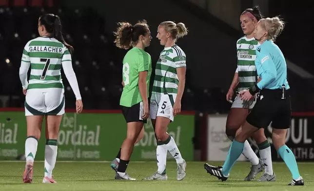 Tempers flare between Vorskla Poltava's Anastasiya Kumeda, centre left, and Celtic's Natalie Ross during the UEFA Women's Champions League, Second Round Qualifying, Second Leg match between Celtic and Vorskla Poltava at the Albert Bartlett Stadium in Airdrie, Scotland, Thursday Sept. 26, 2024. (Andrew Milligan/PA via AP)