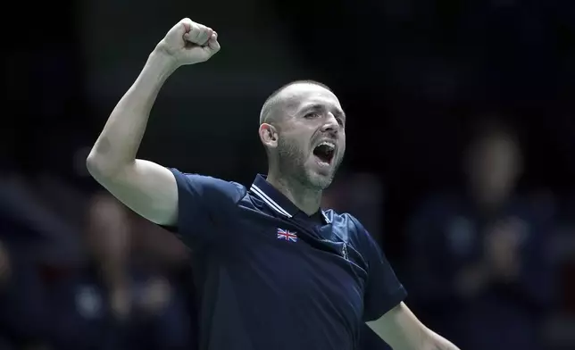 Britain's Daniel Evans celebrates victory over Finland's Eero Vasa during the Davis Cup group stage finals match at the AO Arena, in Manchester, England, Wednesday, Sept. 11, 2024. (Martin Rickett/PA via AP)