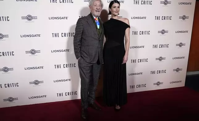 Ian McKellen, with Gemma Arterton, as they pose for photographers upon arrival at the European Premiere of the The Critic, In London, Monday, Sept. 2, 2024. (AP Photo/Alberto Pezzali)