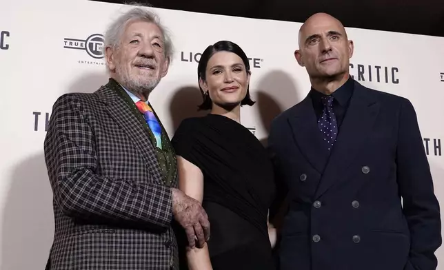 Ian McKellen, left, with Gemma Arterton, centre and Mark Stong as they pose for photographers upon arrival at the European Premiere of the The Critic, In London, Monday, Sept. 2, 2024. (AP Photo/Alberto Pezzali)