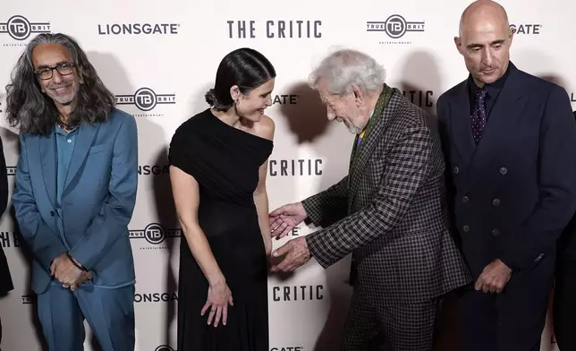 Ian McKellen, centre right, with Gemma Arterton, centre left, as they pose for photographers upon arrival at the European Premiere of the The Critic, In London, Monday, Sept. 2, 2024. (AP Photo/Alberto Pezzali)