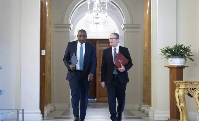 Britain's Prime Minister Keir Starmer, right, and Foreign Secretary David Lammy at the British ambassador's residence in Washington, Friday Sept. 13, 2024, before their meeting with US President Joe Biden. (Stefan Rousseau/Pool via AP)