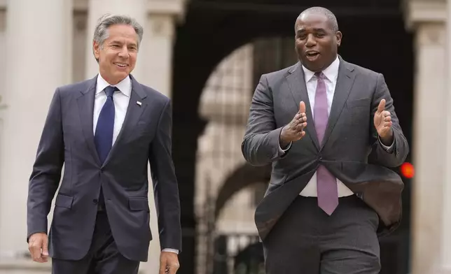 U.S. Secretary of State Antony Blinken, left, talks to Britain's Foreign Secretary David Lammy as he arrives for a meeting at the Foreign, Commonwealth and Development Office (FCDO) in London, Tuesday, Sept. 10, 2024. (AP Photo/Mark Schiefelbein, Pool)