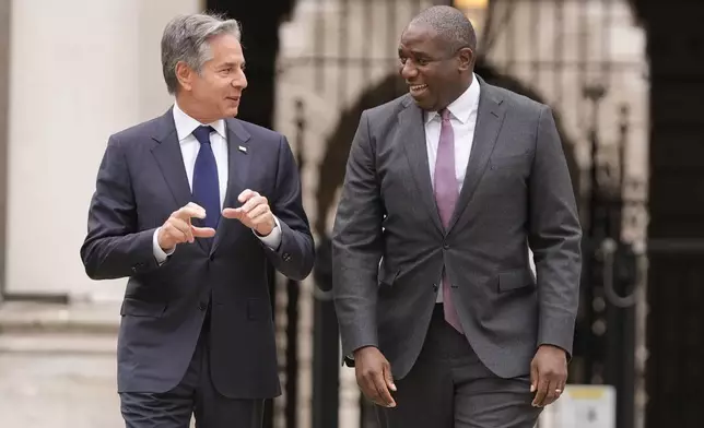 U.S. Secretary of State Antony Blinken, left, talks to Britain's Foreign Secretary David Lammy as he arrives for a meeting at the Foreign, Commonwealth and Development Office (FCDO) in London, Tuesday, Sept. 10, 2024. (AP Photo/Mark Schiefelbein, Pool)