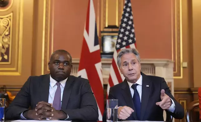 Secretary of State Antony Blinken, right, gestures as he participates with Britain's Foreign Secretary David Lammy, in a strategic dialogue meeting at the Foreign, Commonwealth and Development Office (FCDO) in London, Tuesday, Sept. 10, 2024. (AP Photo/Mark Schiefelbein, Pool)