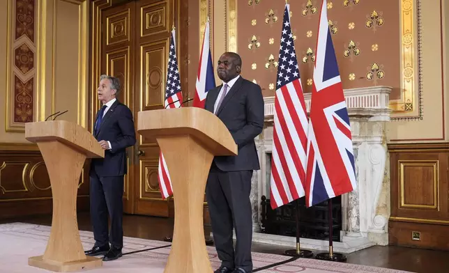 Secretary of State Antony Blinken, left speaks during a joint press conference with Britain's Foreign Secretary David Lammy in the Locarno room at the Foreign, Commonwealth and Development Office (FCDO) in London, Tuesday, Sept. 10, 2024. (AP Photo/Mark Schiefelbein, Pool)