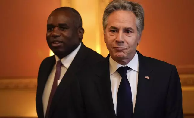 Secretary of State Antony Blinken, right, arrives for a strategic dialogue meeting with Britain's Foreign Secretary David Lammy at the Foreign, Commonwealth and Development Office (FCDO) in London, Tuesday, Sept. 10, 2024. (AP Photo/Alberto Pezzali, Pool)