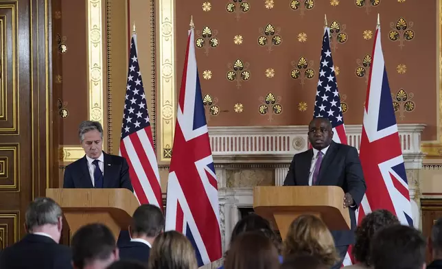 U.S. Secretary of State Antony Blinken, left, listens to Britain's Foreign Secretary David Lammy during a joint press conference in the Locarno room at the Foreign, Commonwealth and Development Office (FCDO) in London, Tuesday, Sept. 10, 2024. (AP Photo/Alberto Pezzali, Pool)