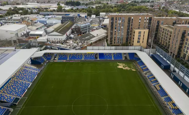 An aerial view of the sinkhole on the pitch at the Cherry Red Records Stadium, the home of soccer team AFC Wimbledon in south west London, Monday Sept. 23, 2024. (Joe Giddens/PA via AP)