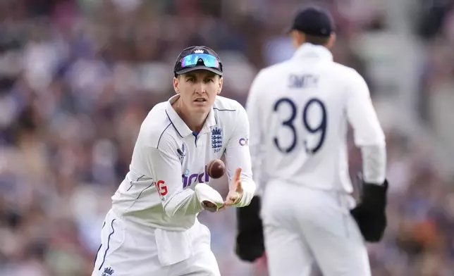 England's Harry Brook catches a ball during day three of the Third Rothesay Men's Test cricket match between England and Sri Lanka in London, England, Sunday, Sept. 8, 2024. (John Walton/PA via AP)