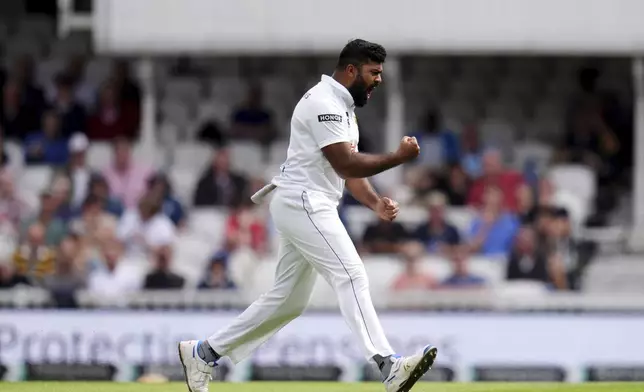 Sri Lanka's Lahiru Kumara celebrates taking the wicket of England's Ollie Pope during day three of the Third Rothesay Men's Test cricket match between England and Sri Lanka in London, England, Sunday, Sept. 8, 2024. (John Walton/PA via AP)