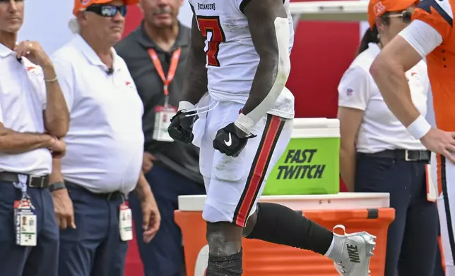 Tampa Bay Buccaneers running back Bucky Irving celebrates a long run against the Denver Broncos during the first half of an NFL football game, in Tampa, Fla. on Sunday, Sept. 22, 2024. (AP Photo/Jason Behnken)