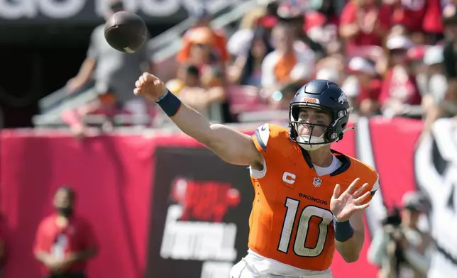 Denver Broncos quarterback Bo Nix (10) throws a pass during the second half of an NFL football game against the Tampa Bay Buccaneers, in Tampa, Fla. on Sunday, Sept. 22, 2024. (AP Photo/Chris O'Meara)