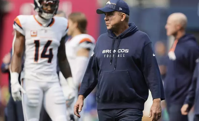 Denver Broncos head coach Sean Payton looks on during warmups before an NFL football game against the Seattle Seahawks, Sunday, Sept. 8, 2024, in Seattle. (AP Photo/John Froschauer)