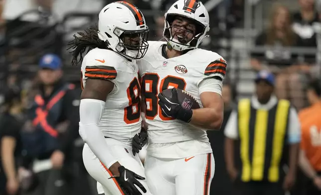 Cleveland Browns tight end Blake Whiteheart, right, celebrates his touchdown with teammate tight end Jordan Akins during the first half of an NFL football game against the Las Vegas Raiders Sunday, Sept. 29, 2024, in Las Vegas. (AP Photo/John Locher)