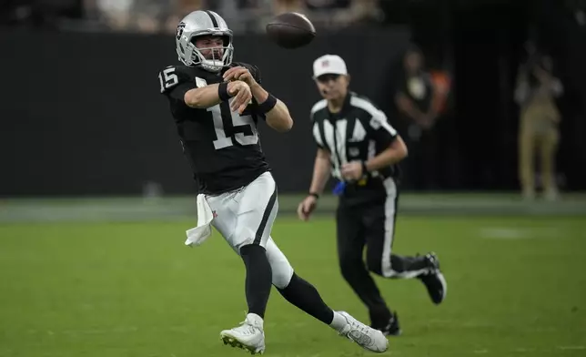 Las Vegas Raiders quarterback Gardner Minshew throws a pass during the second half of an NFL football game against the Cleveland Browns Sunday, Sept. 29, 2024, in Las Vegas. (AP Photo/John Locher)