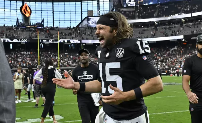 Las Vegas Raiders quarterback Gardner Minshew celebrates after the Raiders defeated the Cleveland Browns during in an NFL football game Sunday, Sept. 29, 2024, in Las Vegas. (AP Photo/David Becker)